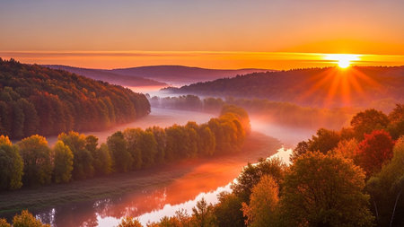 Foggy sunrise over the river. Colorful autumn landscape.の素材