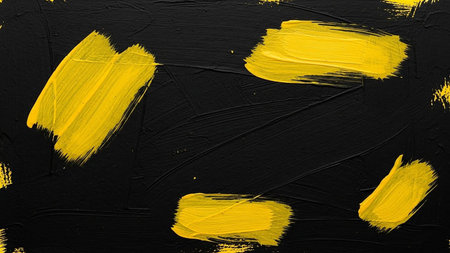 abstract black background with yellow paint brush strokes. High quality photoの素材