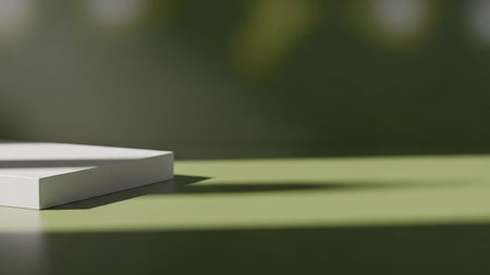 3D render of a simple white pedestal on a green backgroundの素材