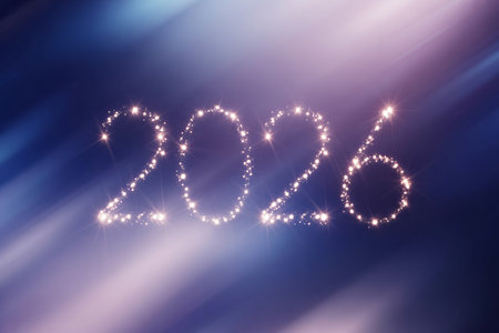 2026 written with sparkle on blue background.の写真素材