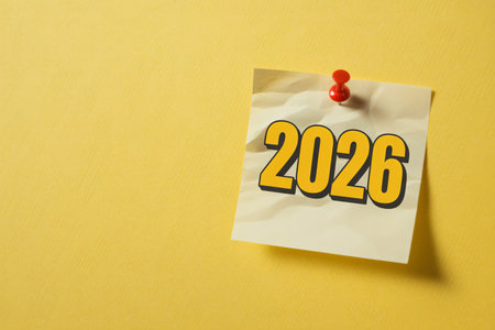 New Year's resolutions on a sticky note on a yellow backgroundの写真素材