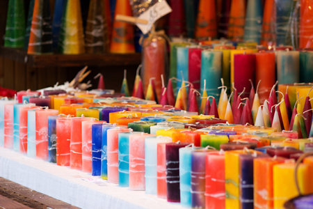 multicolored handmade candles of various shapes and sizesの写真素材
