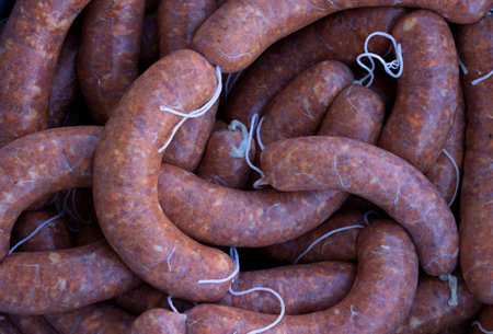 fresh homemade spicy pork sausages ready for smoking