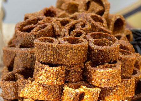 chocolate pastries with piese of nuts ready to sell on the market