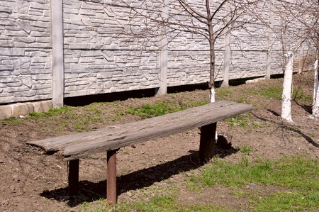Caring owners. Bench by the fence for a tired travelerの写真素材