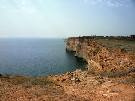 Crimean coast. Cape Tarkhankut. Black Sea. Rocky inhospitable coast and transparent calm azure sea.の写真素材