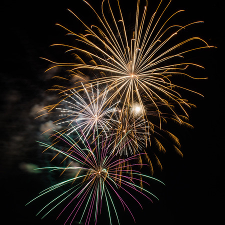 Fireworks up in the sky on the eve of 4th of Julyの写真素材