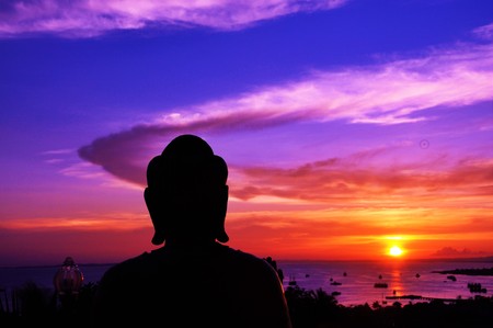 Sunset with Buddha Statue, Sorong, West Papua, Indonesiaの写真素材