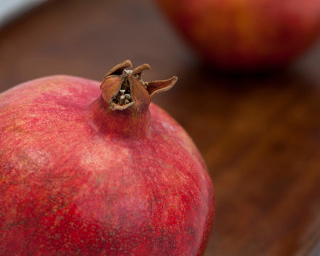 Pomegranate Tip on Wood Boardの写真素材