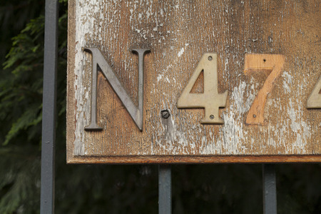 Number Four and Seven, or Forty Seven with Letter N on a Sign or Broken Plaqueの写真素材
