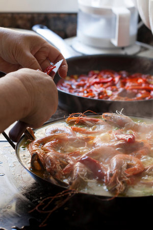 Steamy Homemade Paella Traditionally Cooked with Prawns and Shellfishの写真素材
