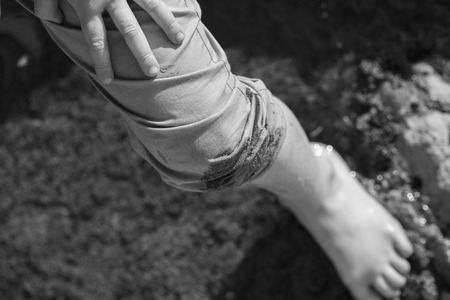 Boy's Foot and Leg Wet While Playing Near Tidal Poolsの写真素材