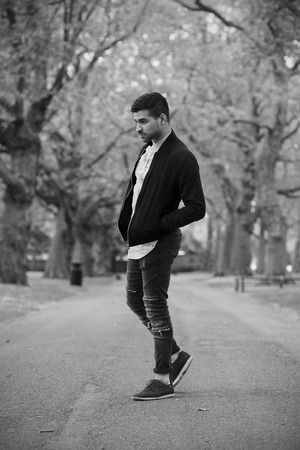 Stylish Man in Jack with Beard in Parkの写真素材