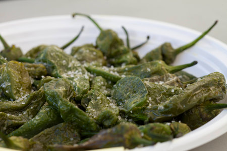 Small Grilled Green Peppers with Chunky Salt for Spanish Tapasの写真素材