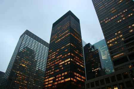 Highrise buildings at dusk in midtown Manhattan, New Yorkの写真素材
