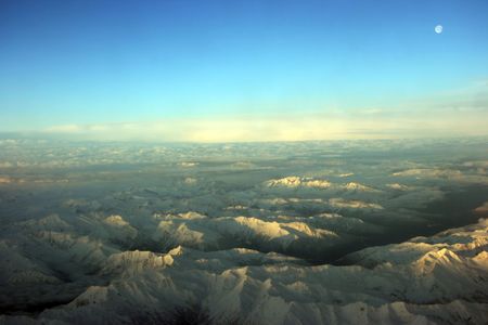 Flying over white mountains at sunset, Midwest USAの写真素材