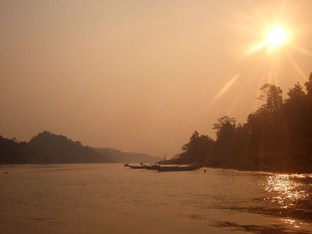Haze over Borneo river, flare intentionalの写真素材