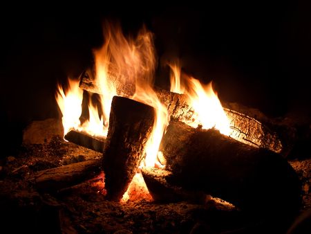 Wood chunks burning in the darkの写真素材