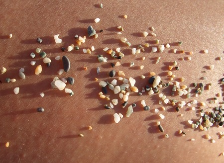 Pebbles on skin, closeup, evening sunの写真素材
