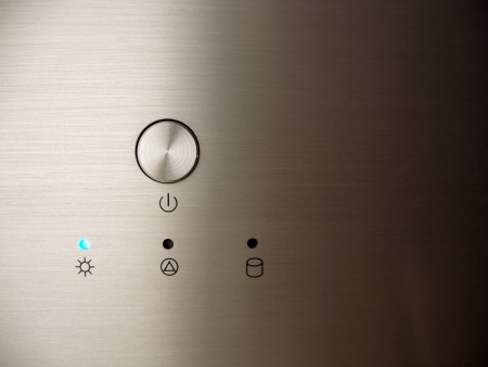 Brushed metal home theatre pc close up of power button and status ledsの写真素材