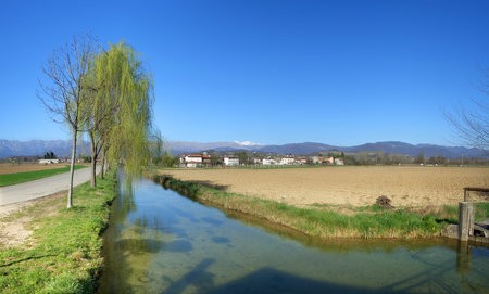 Countryside river in early spring, panoramic viewの写真素材