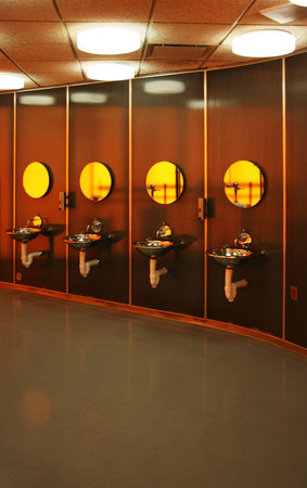 Four washstands in a minimalistic public restroom