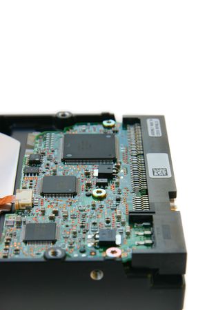 Hard disk side view, focus on chips, isolated on white backgroundの写真素材