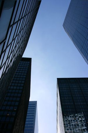 Glass skyscrapers seen from below in the financial district, Manhattan, New York, verticalの写真素材