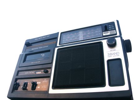 Old portable radio cassette player angled view isolated on whiteの写真素材