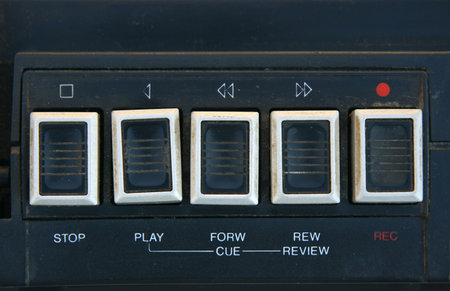 Old and dirty cassette player play buttons