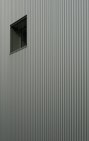 detail of a window in a perimetral wall in a modern building in San Franciscoの写真素材