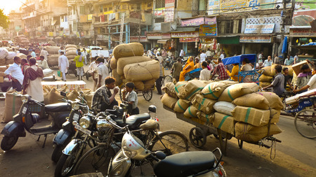 NEW DELHI, INDIA- August 8, 2009: Carts loaded with sacks full of chili near New Delhi spice market.のeditorial素材