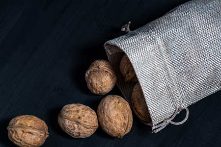 Walnuts on a wooden dark tableの写真素材