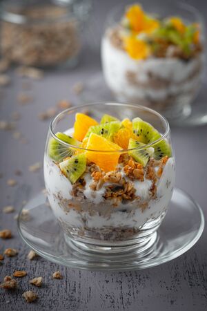 Healthy meal made of granola, yogurt and fruits. Delicious food for breakfast.	の写真素材