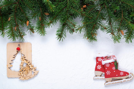 Christmas background with fir branches and decor on a white board.の写真素材