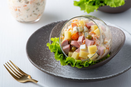 Traditional Russian salad Olivier with vegetables, ham and mayonnaiseの写真素材