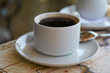 Fresh hot coffee on table in cafe interiorの写真素材