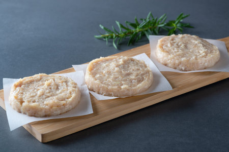Fresh raw chicken cutlets on a gray background.の写真素材
