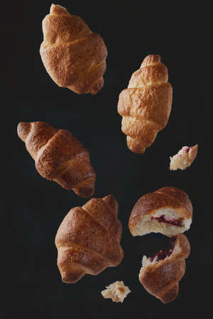 Falling delicious fresh baked croissantsの写真素材