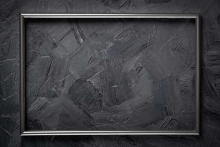 Metal frame on gray grunge textured backgroundの写真素材