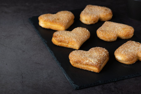 Heart shaped biscuits on cutting board