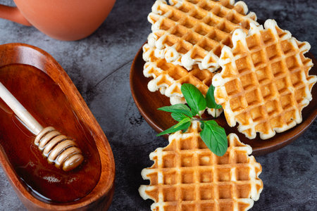 Breakfast with Belgian waffles, honey and coffee