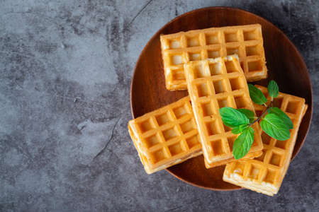 Breakfast with Belgian waffles on the gray table. Copy spaceの写真素材