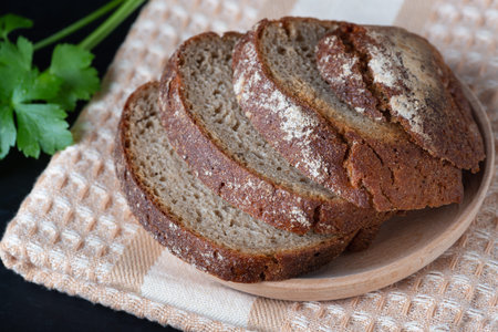 Sliced rye bread on a wooden table
