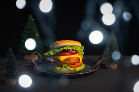 Christmas background with lights and burgerの写真素材