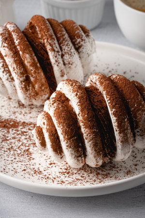 Meringue Cookies with chocolate in a white plate.の写真素材