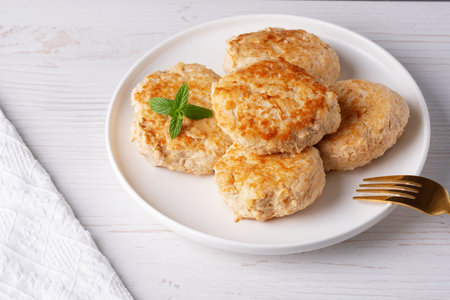 Roasted chicken cutlets on white plateの写真素材