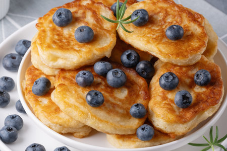 Homemade mini pancakes with blueberries.
