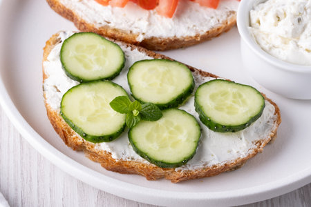 bread with cottage cheese and cucumbersの写真素材