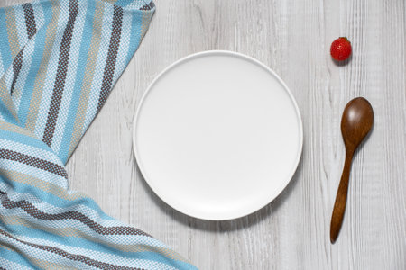 Empty plate on white wooden backgroundの写真素材